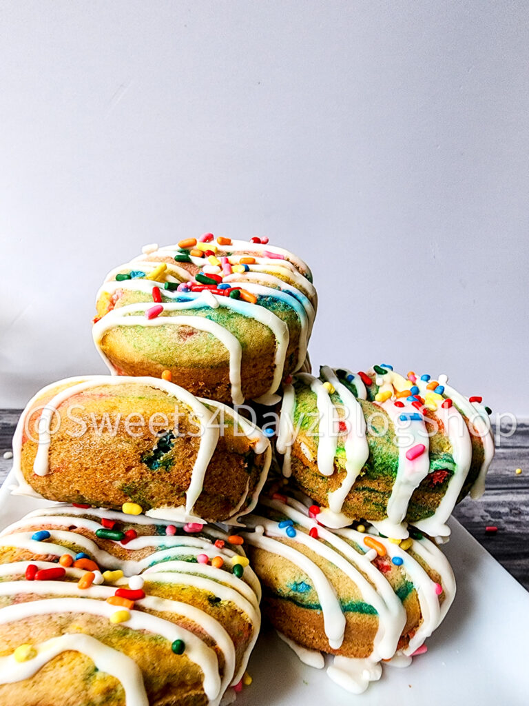 Vegan Rainbow Funfetti Donuts on Grey Wood