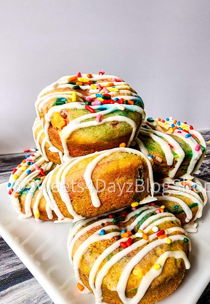 Vegan Rainbow Funfetti Donuts on Grey Wood - Image 3