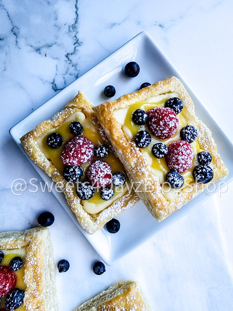 Handheld Puff Pastries on Marble - Image 2