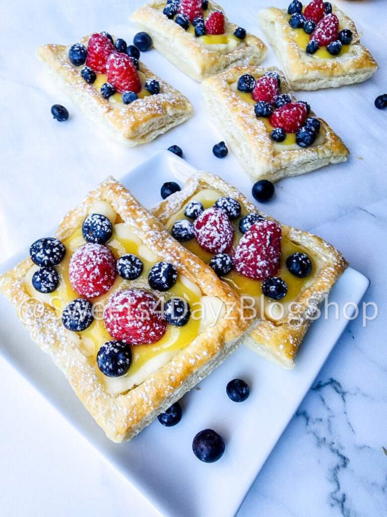 Handheld Puff Pastries on Marble - Image 4