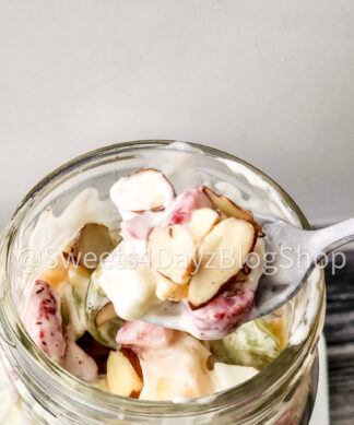 Creamy Fruit Salad on Grey Wood