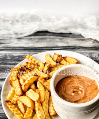 Copycat Raisin Cane's Sauce on Grey Wood
