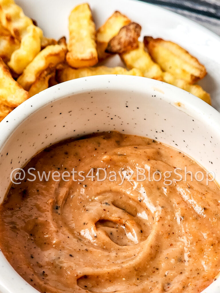 Copycat Raisin Cane's Sauce on Grey Wood - Image 4