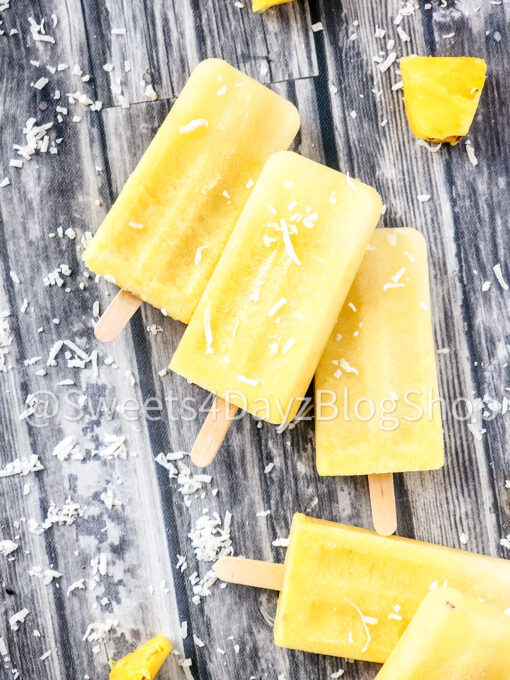 Pineapple Coconut Popsicles on Grey Wood - Image 2