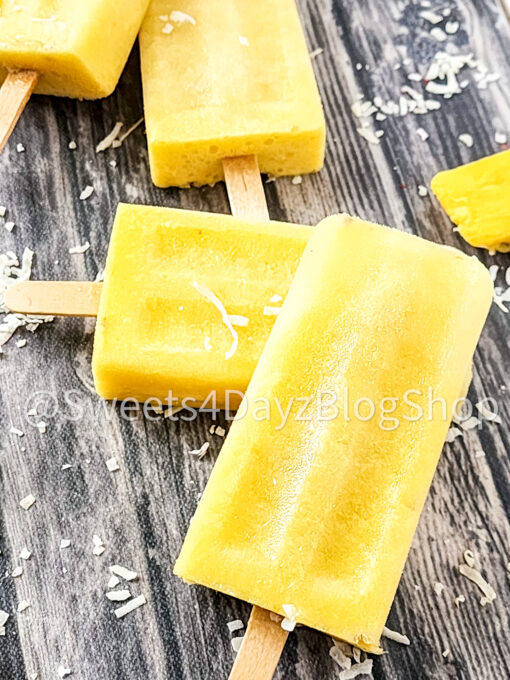 Pineapple Coconut Popsicles on Grey Wood - Image 6