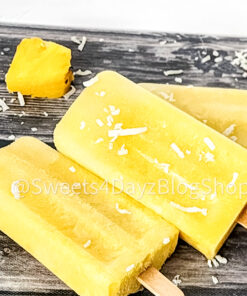 Pineapple Coconut Popsicles on Grey Wood