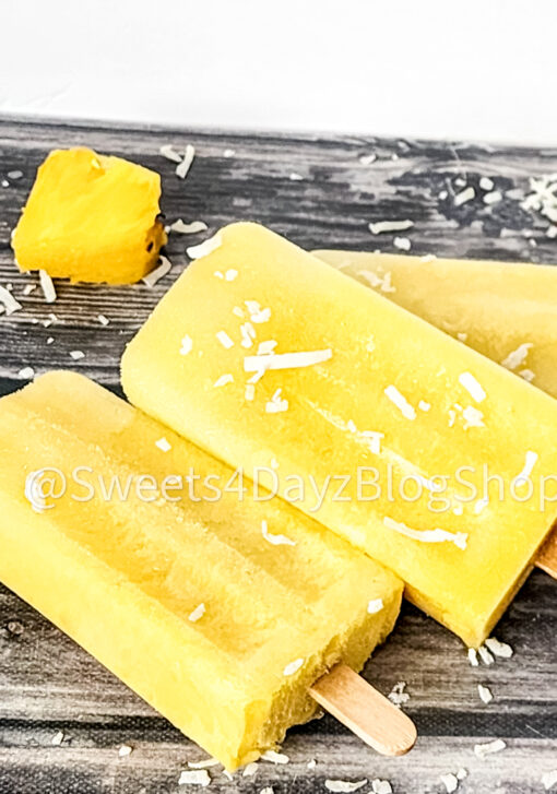 Pineapple Coconut Popsicles on Grey Wood