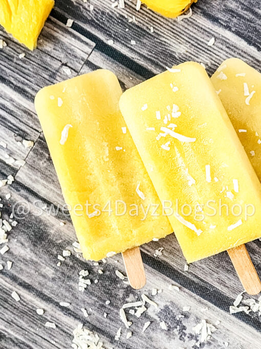 Pineapple Coconut Popsicles on Grey Wood - Image 8