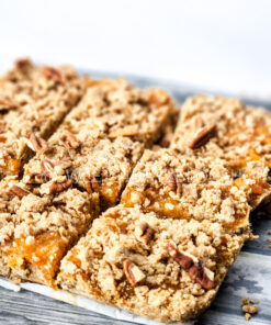 Brown Butter Crumbly Peach Bars on Grey Wood