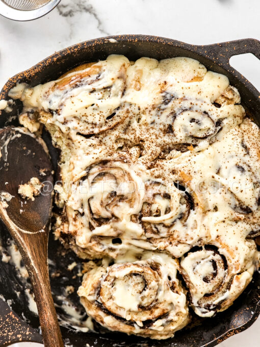 Cast Iron Chocolate Caramel Cinnamon Rolls on Marble