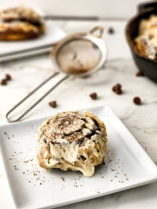 Cast Iron Chocolate Caramel Cinnamon Rolls on Marble - Image 5